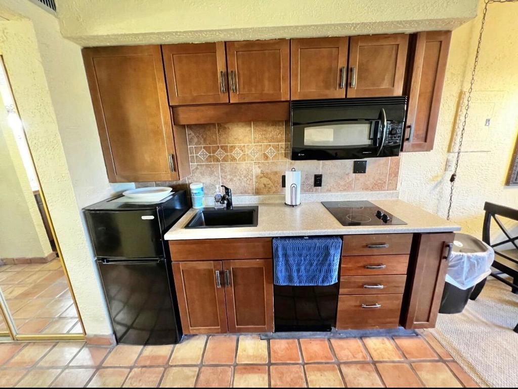 Charming Turnkey Studio in Shadow Mountain Resort. Welcome to this adorable furnished studio condo in the heart of Palm Desert! Located in the desirable Shadow Mountain Resort community, this light-filled unit features an open-concept floor plan and a convenient kitchenette with a fridge and cooktop--perfect for easy meal prep. Step onto your private balcony and enjoy panoramic Mountain View's along with a clear look at the sparkling community pool and tennis courts. Whether you're relaxing inside or soaking in the desert sun, this condo offers a perfect blend of comfort and lifestyle.Just blocks from El Paseo's world-class shops and restaurants and close to beautiful hiking trails, this move-in-ready gem makes an ideal full-time residence, weekend getaway, or investment property. Resort-style living awaits!