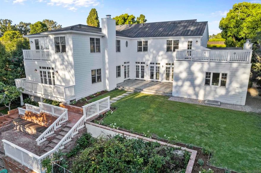 Stunning traditional Cape Cod style home on a lovely quiet street in the coveted Muirlands. Ideal for large scale entertaining with spacious dining room, butler’s pantry, wine storage, and an expansive elegant living room. 5+ bedrooms with offices and laundry rooms on both floors, 6 baths, 2 laundry rooms, an entry level ensuite bedroom plus a huge basement wine storage room that's perfect for gym or studio. The primary suite is a sumptuous retreat w walk-in closet, luxurious limestone bath and balcony. Chef’s gourmet kitchen w/ Wolf range, spacious carrara marble island and subzero fridge, plus hard wood floors, high ceilings, sky lights, custom cabinetry and french doors that open to the pool & garden.