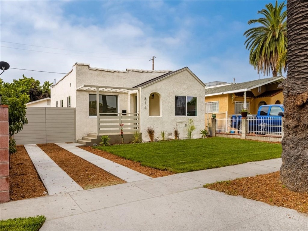 Charming and thoughtfully updated 1923 home on an oversized 4,802 sq. ft. lot in South Los Angeles—blending original character with modern comfort. This light-filled 3 bedroom, 2 bathroom residence showcases an open flow, crisp finishes, and a fresh palette throughout. The heart of the home is a bright, contemporary kitchen with clean cabinetry, stylish tile backsplash, ample prep space, and seamless sightlines into the living areas—perfect for everyday living or entertaining. Wide-plank-looking floors, recessed lighting, and large windows amplify the sense of space and airiness.
All bathrooms feel renovated and serene, with tasteful tile work and fixtures that strike the balance between timeless and current. Bedrooms are well-proportioned and receive abundant natural light.
A standout feature is the converted garage, currently configured as flexible living space with its own entry—ideal as a potential ADU, home office, 4th bedroom, guest suite, or income-producing unit (buyer to investigate permits). The enormous backyard offers rare outdoor space for gardening, gatherings, or future enhancements.
Located in a convenient area of 90044, this home is close to everyday amenities, transit access, and provides easy connectivity to surrounding neighborhoods. Perfect for homeowners seeking a turnkey classic with upside or investors looking for a strategic value-add opportunity.
Highlights:
* 3 BD / 2 BA + converted garage (flex space/possible ADU or 4th bedroom)
* Updated kitchen and bathrooms
* Bright, open living spaces with modern finishes
* Large lot with significant backyard
* Original 1923 charm with tasteful contemporary renovations
Don’t miss this rare blend of character, functionality, and potential—schedule your showing today.
Buyer to verify all facts, square footage, and permitted uses.