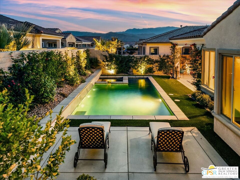 Step into this stunning Spanish PLAN 4 SANCTUARY, where privacy and entertainment effortlessly come together. With leased SOLAR ($131.96) and a DOUBLE CENTER SLIDING GLASS DOOR, the home extends your living space outdoors, leading to a secluded patio that enhances the beauty of the waterfall pool and spa -- your personal retreat for relaxation and entertaining. This thoughtfully designed floor plan is celebrated for its "just right" square footage, and it's easy to see why. The rich warmth of wood cabinetry pairs beautifully with 12x24 porcelain tile flooring, while upgraded Calcutta quartz countertops and stainless-steel appliances, including a gas cooktop, elevate the kitchen's modern elegance. A walk-in pantry, spacious eat-at island, and 32" stainless sink make this space as functional as it is stylish. Enjoy morning coffee in the sunlit Cafe with direct patio access or unwind with alfresco dining by the pool under the stars. The expanded owner's suite boasts a bay window, flooding the space with natural light, while the spa-like owner's bath features dual vanities, a tiled roll-in shower, and a generous walk-in closet. A private en-suite guest room ensures comfort for visitors, while the dedicated den/office, complete with a door package for added privacy, is perfect for productivity. Additional highlights include a coveted powder room, pre-plumbed gas stub for a fire pit, and included washer, dryer, and fridge. Discover the perfect balance of style, comfort, and resort-style living in this exquisite home at Del Webb, your premier 55+ community with so much to offer!