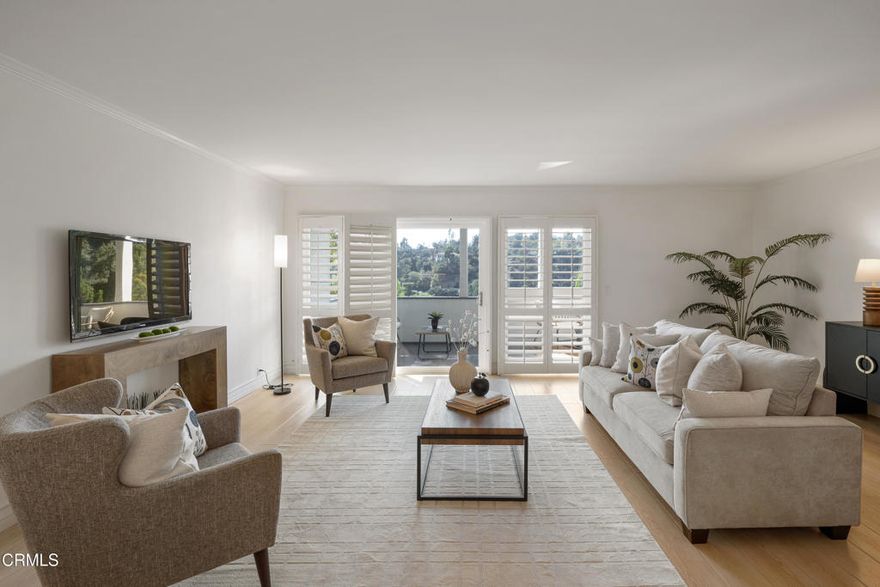 Set within a tree-lined neighborhood surrounded by classic Pasadena architecture and just moments from the famed Gamble House, this thoughtfully updated top-floor condo combines timeless charm with modern comforts. Upon entering, you're welcomed by elegant herringbone-pattern tile flooring that sets the tone for the home. To the left of the entry, the updated kitchen features recessed lighting, crown molding, and stainless steel appliances, including a 5-burner electric induction range. A custom-tiled backsplash, under-cabinet lighting, and a convenient eat-at quartz countertop create both style and function. The kitchen opens seamlessly to the dining area and living room, enhanced with crown molding and wood-like laminate flooring throughout. Off the living room, sliding glass doors with wood-louvered shutters lead to a spacious balcony with peaceful views of the Arroyo and the rolling hills of Linda Vista. Continuing straight from the entry, you'll find a closet and a charming dry bar with cabinets and accent lighting. To the right, the hallway leads to two bedrooms and two bathrooms. The first full bath offers a deep tub and shower combination with subway tile to the ceiling, along with an oversized single-sink vanity topped with quartz. Adjacent sits the first bedroom, complete with a mirrored closet, ceiling fan, and wood shutters. Hallway linen cabinets and a utility closet provide extra storage. The primary suite is a private retreat with dual mirrored closets, a ceiling fan, and balcony access overlooking the pool and hillsides. The ensuite bath includes an oversized single-sink vanity with stone countertops, one inch Carrara marble hexagon tile flooring, and a glass-enclosed shower. Additionally, this well-maintained gated community offers a private gated pool and lounging area. Also, just outside the building there is trail access leading down to Brookside Park, Brookside Golf Course, and the iconic Rose Bowl where you can enjoy the occasional fireworks, seasonal events, and outdoor recreation. Plus you are only moments away from all the shops, dining, and entertainment of Old Town Pasadena.