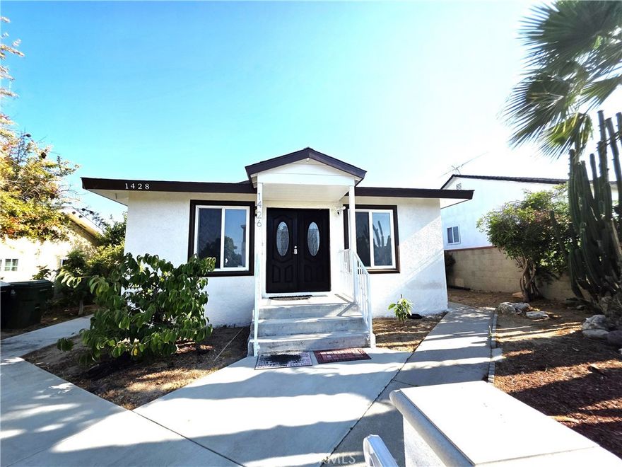 Newly remodeled 4 Bedroom, 2 bath house front house/2 on lot, hardwood floors throughout, nice size living room with big windows and double entry doors. Kitchen has granite counter tops, travertine floors, big peninsula for bar stool seating, large sink, stainless steal appliances. Remolded hall bathroom, All bedrooms have ceiling fans. Master bedroom has French  doors that lead out to a nice sized deck, also has an on suite bathroom with marble tile on floor and in shower. Central heating  & air, washer/dryer hook ups in house.2 dedicated parking spots in rear of property.