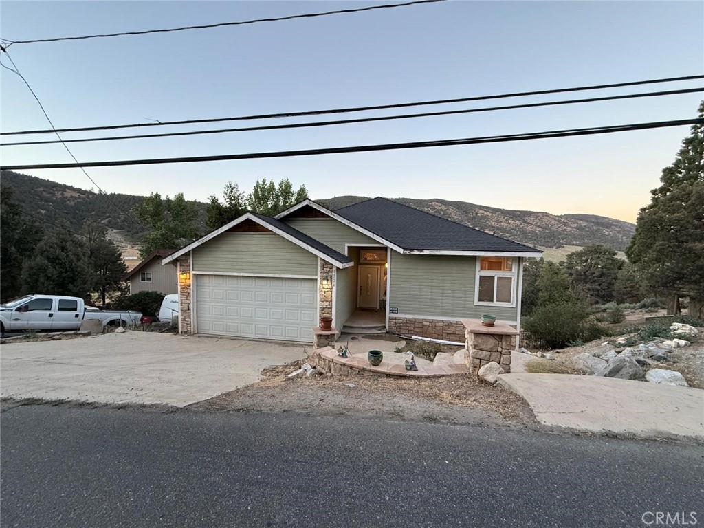 This 3-bedroom, 3-bathroom (per assessor data is 3 bedroom 2 bathroom ) home offers a peaceful escape with a cozy cabin-like feel, nestled in nature. The spacious primary suite upstairs includes a walk-in closet, while two additional bedrooms and an office/den are located downstairs.
Enjoy scenic views from the open living room with pellet stove and direct access to a private balcony/deck. The bright dining area and gourmet kitchen—with granite countertops and ample cabinets—make entertaining a breeze.
Additional features include central heating, designated laundry room, an attached garage, and a large backyard perfect for dogs or outdoor enjoyment. Experience comfort, charm, and space just outside the city.