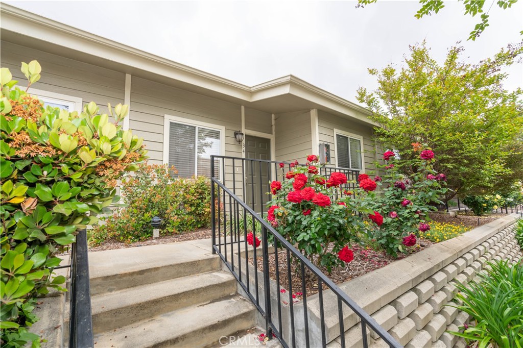 This beautiful SHADOW MOUNTAIN TERRACE townhouse is nestled amidst rolling hills community, Here are just a few of its many other fine features: *You’ll step into a flowing 922 square foot open concept floor plan that is in “MOVE-IN-CONDITION” with a complementary paint scheme, high ceilings, and tasteful blend of paver and laminate flooring *The spacious living room is bathed in natural light from a multitude of windows and dual sliding glass doors to the entertainer’s patio *The family’s cook will appreciate the kitchen’s abundant cabinets, ample counters, and the convenience of the adjoining dining area *Both of the upstairs bedrooms are configured as master suites with their own bathrooms; One has a large walk-in closet *A total of 2½ bathrooms; The ½ bathroom is located on the first level for your guests *Central heat & air for year-round comfort *You’re going to enjoy the very private enclosed patio *Laundry functionally located inside the 2 car garage with automatic door *Great location close to Hansen Dam’s extensive recreational amenities and equestrian trails.