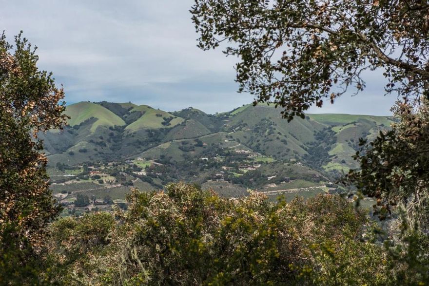 Rare opportunity with this lovely view lot with water close to Carmel Valley Village. 48+ acres with several areas of flat usable land studded with mature oak trees and plenty of sun exposure. The parcel abuts Garland Park recreational area, so you can connect to the horse trails right from your own property