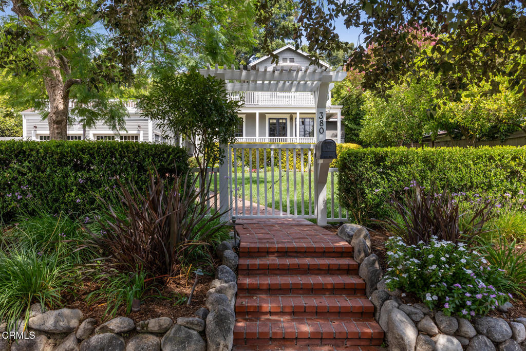 Nestled on a picturesque street in Pasadena's sought-after South Arroyo neighborhood, this quintessential 1910 farmhouse blends timeless charm with thoughtful modern updates. A welcoming front porch and spacious, level lawn set the tone for the inviting lifestyle this home offers.Inside, natural light fills the gracious living and dining rooms, each flowing seamlessly toward the heart of the home -- a beautifully remodeled kitchen that opens to the family room with custom built-ins. French doors lead to a covered patio overlooking the sparkling pool -- an entertainer's dream for effortless indoor/outdoor living and year-round gatherings.Upstairs features three comfortable bedrooms, two updated baths, and a light-filled office or reading nook. A private upper patio offers a quiet retreat with treetop views.Additional highlights include a two-car garage with bonus flex space ideal for a studio, gym, or home office, dedicated laundry, and powder room. Previously approved plans for an ADU garage conversion are currently expired but could easily be reinstated, offering exciting potential for additional living space or rental income.Located just moments from the Rose Bowl, Old Pasadena, and scenic Arroyo trails, 380 California Terrace offers the very best of Pasadena living -- classic character, modern comfort, and an entertainer's dream setting in one of the city's most desirable neighborhoods.