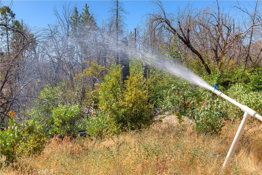 Tucked away in the Sierra Foothills just above Lake Oroville is this 40 acre retreat with all hookups:  septic, PGE, well and a nice 5th wheel behind a locked gate.  Possiblities are endless..  If you dream of escaping the urban life this magical spot is surrounded by nature with plenty of room to roam.  The recent photos tell the enticing story.