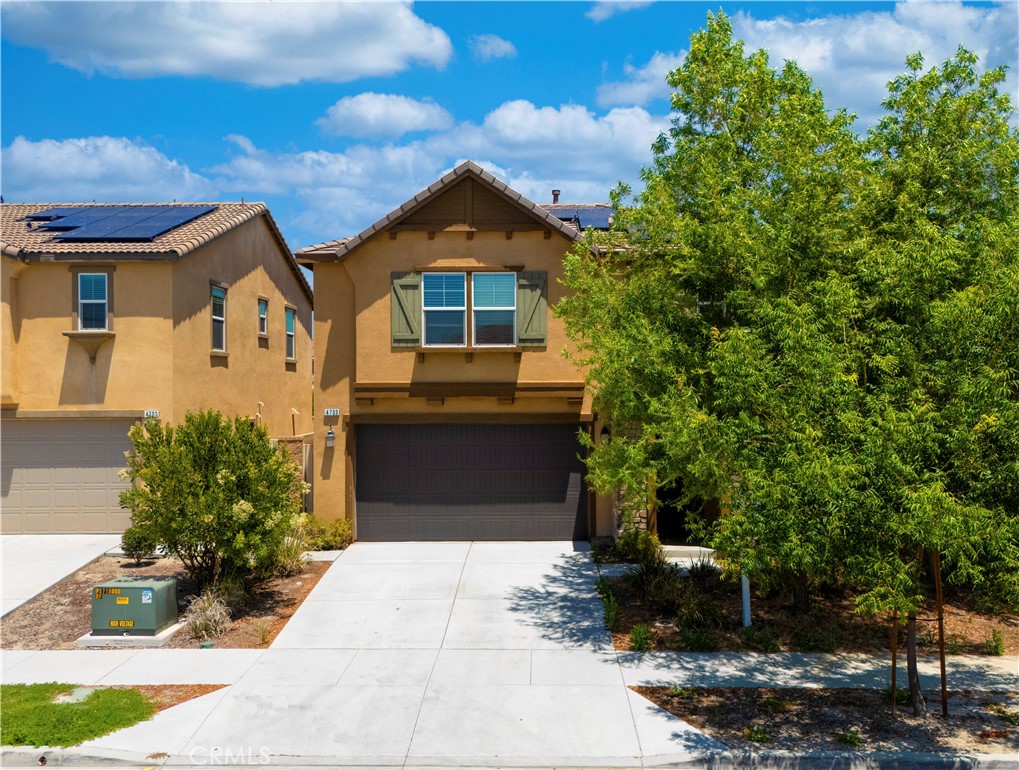 Featuring paid-off solar, this elegant home sits in the desirable Northpark Community of Ontario Ranch. Built in 2019, this Cottage-style two-story residence offers an open-concept layout with a modern kitchen featuring white cabinetry, ash grey quartz countertops, an enlarged island throughout. Downstairs features a spacious great room pre-wired for a flat panel TV and a full bedroom with bathroom—ideal for guests or multi-generational living. And plus a flex room downstairs provides space for a home office or gym.
Upstairs offers a large loft, laundry room with deep sink, and an oversized primary suite with a walk-in closet, dual vanities, soaking tub, and private balcony. The low-maintenance backyard is ideal for relaxing or entertaining.
Enjoy walking distance to a local park. Community amenities include BBQ areas, basketball courts, greenbelts, and playgrounds. Conveniently located near Costco, 99 Ranch, and the upcoming Walmart Supercenter, with easy access to the 60 and 15 freeways.