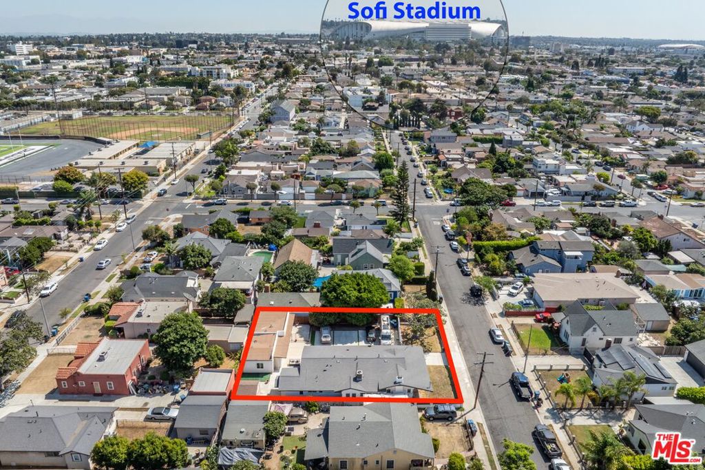 Investors or owner occupants can choose a variety of cash-flow opportunities near SoFi and Market Street on this extra-large lot containing a 3-bed/2-bath single-family home plus 2 detached apartments, each with dedicated outdoor space and any of 6 secure parking spaces behind double automatic gates. At 1,928 sq ft, the main house is a big, character-rich 1913 Craftsman with original interior woodwork and hardwood floors. The full kitchen with dining nook opens to the living and formal dining rooms. There is central air, a dedicated laundry room and large closets. If desired, the rear bedroom and adjacent remodeled bathroom can function as a separate suite with private entrance. The double gates give the home its own gated front yard, and in the back there is a patio and spa that could either be private or shared. The one-bedroom unit, around 500 square feet, has its own gated patio. The current occupant is willing to vacate by the end of the year. The studio, about 375 sq ft, has never been rented and has an adjacent outdoor space that can be fenced for private use. The units are separated by storage and a coin-operated laundry room, and there is an additional freestanding storage shed. Parking features an electric car charger, and the property is wired for fiber internet. Cared for by owner-occupants, the recent improvements include a roof replacement in 2023, electrical panel update in 2018 and new sewer lines in 2015.