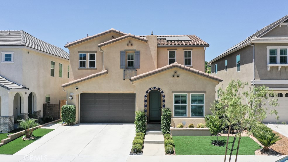 Welcome to 24719 Branch Ct, Corona, CA – Located in the Exclusive Gated Community of Terramor. Experience elevated resort living in the prestigious guard-gated community of Terramor, where scenic vistas and peaceful surroundings create a resort-style retreat. This two-story former model Spanish Style home features 4 bedrooms, 3 baths, one bedroom and 3rd bathroom is located downstairs. The open concept floor plan is very inviting. You can have great interaction while in the kitchen and great room. The modern kitchen with Brandy stain maple cabinets, w/Whirlpool® stainless steel appliances, including a gas cook top, double oven, dishwasher and microwave, white quartz kitchen countertops and island overlook the spacious great room. Additional features include a gas fireplace at the great room, step out to your completed backyard to reflect on the natural beauty that surrounds Terramor. The upstairs loft/bonus room is ideal for a teen room or game room, a master suite includes a walk-in closet and a fiberglass separate tub and shower, an upstairs laundry room is an excellent convenience, two spacious bedrooms and secondary bathroom. Terramor amenities include 5 miles of walking/hiking trails, swimming pool, clubhouse, and several future parks.
