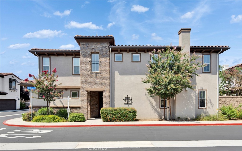 Welcome to this stunning Spanish-Mediterranean style home, where timeless elegance meets modern comfort. Located in a quiet gated community with a low HOA fee of just $172 per month, residents enjoy access to a park, BBQ area, and children’s playground. The charming exterior features a classic wave-pattern tile roof with a life expectancy of over 50 years, complemented by light-toned stucco walls and stone accents for a warm, refined look. Wrought-iron balcony railings, and a graceful arched entryway create an unforgettable first impression. Built only 6 years ago by a reputable developer, this home has been meticulously maintained and thoughtfully upgraded by the owner.
A standout feature is the first-floor bedroom, privately separated from the kitchen and living areas—perfect for hosting guests or accommodating elderly family members. Upstairs, the spacious loft offers flexible living space and can easily be converted into a fifth bedroom if desired.
Additional highlights include:
* Brand-new flooring (replaced original carpet), fresh interior paint, and all new toilets
* Whole-house water softener system for improved water quality
* EV charging outlet installed in the garage
* Energy-efficient tankless water heater
* Third-generation insulated glass windows, offering Tesla-like insulation, soundproofing, and durability
* Former model home with premium cabinetry, appliances, and bathroom fixtures
* Well-separated primary and secondary bedrooms for maximum privacy
* Durable, stylish tile roof
* Elementary, middle, and high schools all within 1 mile.
*15 minutes to California State Polytechnic University, Pomona.
* Move-in ready condition
— Schedule your private tour today and experience this warm and inviting home for yourself!