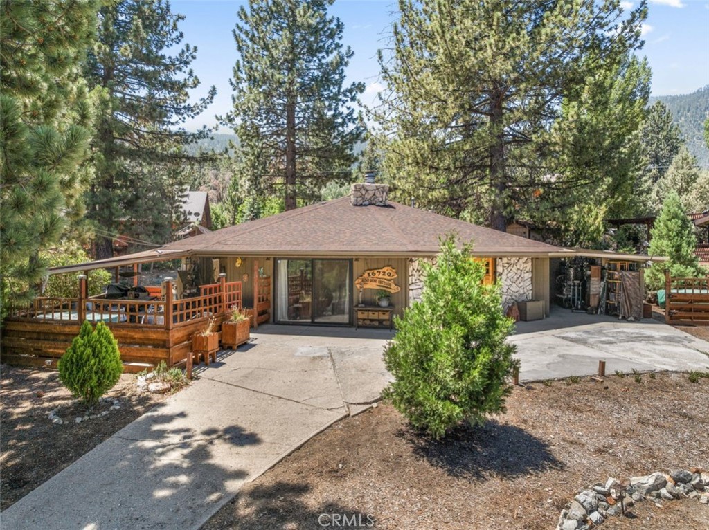 This warm and welcoming single-level home is ideal for full-time living, weekend escapes, or use as a vacation rental. It sits on a mostly flat, usable lot near the west end of town, just a short walk to the clubhouse, equestrian facility, and village center.
A circular driveway offers plenty of parking, along with an attached carport for added convenience. With no stairs inside or out, entry and everyday living are easy and accessible.
Inside, vaulted ceilings and wide-open sight lines give the home an airy, spacious feel. Step outside the kitchen to a cozy, covered patio—perfect for stargazing or entertaining guests.
Thoughtfully curated finishes, furnishings, and color choices give the home a creative, one-of-a-kind feel. Some furniture and décor will stay, making it even easier to settle in and enjoy. The kitchen's butler pantry offers access to an additional 600 square feet of storage overhead while providing useful space for daily needs.
The home's unique circular layout leads you from the kitchen, past the bedrooms and baths, and back into the main living area. Each room offers its own charm and personality, with special touches throughout.
Come explore this truly special home and see why it might be just the place you've been waiting for.