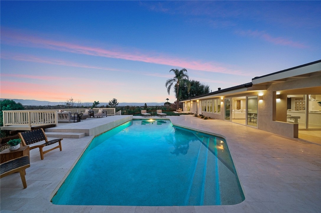 Newly renovated VIEW home nestled at the end of quiet Cul-de-sac within a premier Woodland Hills location. Welcome to the epitome of luxury living showcasing unrivaled finishes and thoughtful design elements to create one amazing home. As you walk in you will be struck by the picture perfect views from almost every window as well as elegant plastered walls throughout. In the heart of the home you will find the gourmet kitchen featuring top notch appliances, custom natural oak cabinetry and center island with nook seating. The primary suite is a peaceful retreat with an indulging bathroom with spacious walk-in closet, massive shower with soaking tub and dual vanity with integrated sinks. The yard is an entertainer's dream and a true paradise featuring panoramic VIEWS, a sparkling pool, build-in BBQ , amazing deck enjoying the spectacular views and a fully enclosed patio perfect for dining/ entertaining . Just minutes from top rated schools, malls and restaurants, within the el camino high district