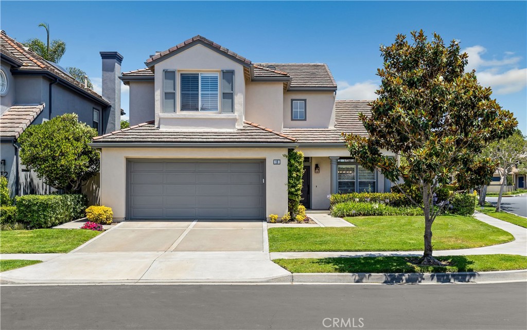Welcome to 16 Menton – a beautifully appointed retreat perched on a corner within the prestigious St.Michel gated enclave in Newport Coast. This light, bright 3-bedroom, 3-bathroom home spans 1,912 sqft with a thoughtfully designed floor plan, vaulted ceilings and perfectly calibrated flow for relaxed California living. Soaring cathedral ceilings welcome you with an abundance of natural light cascading across the living and dining rooms. An elegant fireplace anchors the family room—ideal relaxation or entertaining, seamlessly flowing to the light-filled kitchen.The open kitchen is a chef’s delight, featuring quartz counters, stainless-steel appliances, generous cabinetry and views to the lush, private backyard. Step outside to the serene, beautifully landscaped yard, where you'll enjoy a peaceful retreat under mature shade trees. An expansive patio offers the perfect setting for morning coffee or dining alfresco. Upstairs, the primary suite boasts airy, vaulted ceilings, dual sinks, a separate tub and shower, and a spacious walk-in closet. Two more bedrooms and a full bathroom round out the second floor. Additional highlights include an attached two-car garage and private corner lot. As a resident of St.Michel, take advantage of the extensive community amenities including gated entry, pools, spas, BBQ areas, playground, sand volleyball, tennis and basketball courts. Ideally situated close to Newport Coast Shopping Center, Fashion Island, award-winning schools, scenic walking paths, and easy freeway access—16 Menton strikes the perfect balance of community charm and modern comfort. Don’t miss this rare opportunity for turnkey living in one of Newport Coast’s most desirable pockets.