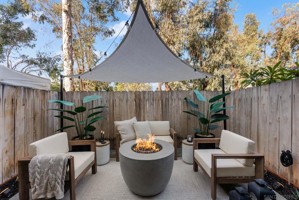 The highly desirable neighborhood of Talmadge presents this beautiful two-bedroom, two-bath townhome! Equipped with two patios and a tandem two-car garage, this spacious layout with both bedrooms upstairs, an ensuite bath and balcony overlooking the canyon is a must see! Not only does this home come with in-unit W/ D & oversized laundry closet, but also contains multiple ceiling fans, A/C, breakfast bar, a skylight, recessed lighting, backyard, window shutters, fireplace & original terracotta tiles. This centrally-located Talmadge property puts you at the center of San Diego- including San Diego State University, all major freeways and only a 15-minute drive to the beach! HOA offers great value as it includes water, outside maintenance & landscaping. You will NOT want to miss this incredible home!!