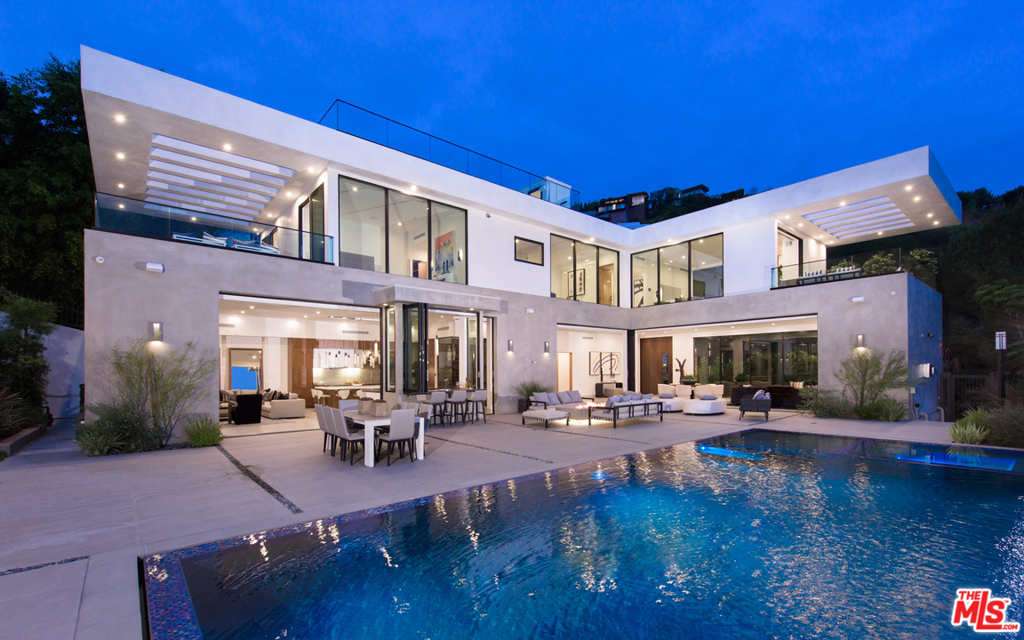 Experience the epitome of luxury living in this stunning, brand new smart home located just minutes from all the shops, dining, and entertainment the Sunset Strip has to offer. This home boasts an abundance of natural light, and an open floor plan that seamlessly transitions from indoor to outdoor living. The kitchen includes professional grade appliances, a dumbwaiter, and a prep kitchen. With an unparalleled recreation room that includes a theater, gym, sauna, wine cellar, and wet bar, this home is ideal for entertaining. Features include a luxurious master suite with gorgeous views and resort-like amenities, an office, and three additional spacious bedrooms. Pocket sliding doors open up to the expansive backyard oasis complete with indoor/outdoor bar, baja deck, sparkling pool and spa, fire pit, and ample space for dining and relaxation. Soak up the sun or enjoy breathtaking views from the rooftop deck and the expansive balconies.
