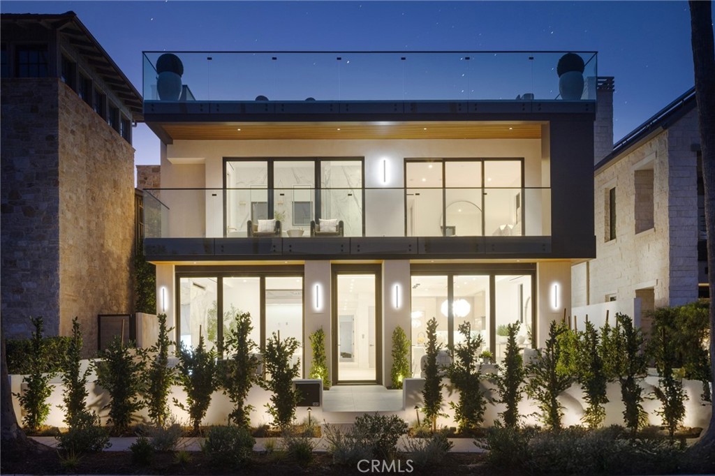 Experience the pinnacle of coastal luxury in the heart of Corona del Mar Village at 303 Goldenrod. This brand new construction, designer-crafted home offers 5 bedrooms (all ensuite), 5.5 baths, and nearly 3,000 square feet of refined living space plus outdoor living. Situated on the coveted 300 block and a rare 40-foot wide lot, this property is just steps from the iconic Goldenrod Footbridge and a short stroll to the beach, boutiques, and restaurants. Every detail of the home has been curated for elegance and livability, from the open-concept main level that flows effortlessly to an expansive front patio, to a private side courtyard complete with a tranquil water feature, fireplace, and built-in heat lamps. Ideal for entertaining or everyday living, the seamless connection between these spaces captures the essence of the coastal Orange County lifestyle. The chef’s kitchen is a showpiece of form and function, featuring custom cabinetry, top-tier appliances, and a striking center island designed for both entertaining and everyday ease. Ascend to the bedrooms above and the sprawling rooftop deck via your private elevator to take in panoramic ocean views and coastal breezes, perfect for sunset gatherings or morning coffee. With luxe finishes throughout, smart floor plan design, and an unbeatable location, this is a rare opportunity to own a showpiece home in one of the most sought-after neighborhoods in CdM. Available individually or in conjunction with 303.5 Goldenrod. Contact us today for a private showing.