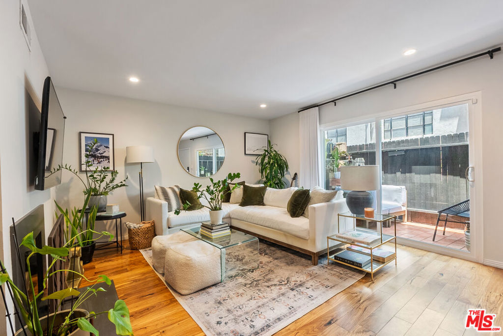 Location, Location, Location! Live in the heart of it all just minutes from the best of Los Feliz and Silver Lake. Enjoy easy access to Griffith Park's hiking trails, plus a vibrant mix of restaurants, bars, cafes, boutiques, and grocery stores. This beautifully renovated, light-filled two-story townhouse offers the perfect blend of comfort and convenience. The open-concept main level features hardwood floors, stainless steel appliances, and a spacious dining area ideal for entertaining or everyday living. Upstairs, you'll find two generously sized bedrooms with large closets, a newly remodeled full bath, and an in-unit washer and dryer for added ease. This small community offers quiet and privacy. Step outside to a private patio perfect for your morning coffee or evening unwind. Additional perks include two assigned tandem parking spots in a secure, gated garage, plus close proximity to major freeways and public transit.