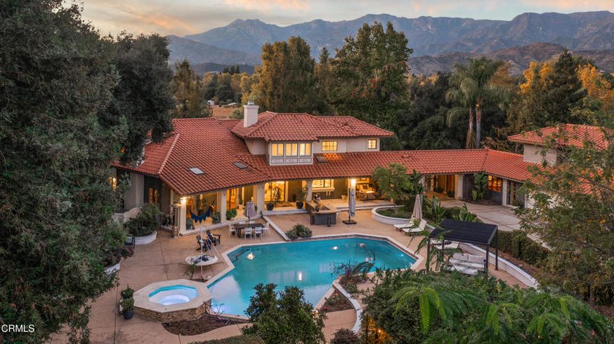 Welcome to your personal utopia, nestled in the exclusive gated community of Rancho Matilija in the beautiful Ojai Valley. This property offers a private sanctuary of absolute bliss. Experience the famous ''pink moment'' sunsets from your custom estate. The main house features beautifully appointed rooms with exaggerated ceilings, three fireplaces (gas or wood burning), and elegant hardwood flooring. The layout is perfectly designed for entertaining, privacy, and warmth. Multiple living spaces and dining areas--both open and intimate--create a perfect harmony of elegance and function. A natural romance and ambiance flows through each beautiful space, both large and small, indoors and out. A separate guest house with stunning views includes a recreation room below, adding another layer of luxury.  Enjoy the tennis and pickleball courts, as well as the private  hiking trails. A private well sustains lush gardens and an organic orchard with apples, lemons, peaches, plums, persimmons, avocados, blackberries, and more! The additional outdoor amenities are equally impressive: a recently renovated pool, jacuzzi, sauna, outdoor kitchen, and charming paved walkways that wind through this dreamy compound. Cozy, built-in seating surrounds the fire pit, and an enchanting, covered gazebo draped in wisteria elevates the senses. Serenity at your fingertips. This property has all the hallmarks of a boutique resort, offering a unique blend of ambiance, character, and one-of-a-kind luxury living.