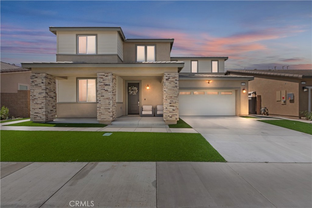 ***Just Built in 2024, This Is The Rare Next Gen® Floorplan You’ve Been Waiting For!*** This isn’t just a home -- it’s a lifestyle upgrade! Located in Fontana’s highly desirable and amenity-filled Arboretum community, this expansive 3,339 SqFt, 4-bedroom home sits on a 6,000 SqFt lot and features the in-demand Next Gen® suite: a full downstairs private living space with its own entrance, retreat area, bedroom, bathroom, kitchenette, and laundry. Whether you're planning for multi-generational living, hosting long-term guests, or exploring a rental opportunity, this layout is unmatched in flexibility. The main home offers modern sophistication with white shaker cabinetry, quartz countertops, a dramatic ceiling-height backsplash, and a massive island perfect for entertaining. Stainless steel appliances, brushed nickel hardware, and recessed lighting complete the look. Upstairs, the loft has been smartly converted into a home theatre -- ideal for movie nights or executive presentations. Throughout the home, you’ll find warm laminate wood flooring, an elegantly upgraded guest bathroom, and thoughtful finishes like a painted/epoxied garage and water-wise landscaping with turf. There’s even a gated side yard—perfect for pets or private storage. All this within Arboretum, where residents enjoy resort-style amenities: pool, spa, fitness center, pickleball, basketball, BBQ pavilion, parks, playgrounds, and more! With top-rated schools, easy access to major shopping (Costco, Target, Sprouts, 99 Ranch), and just minutes from Ontario Airport, Kaiser, Loma Linda Medical, and major commuter routes -- this location checks every box. This is your chance to own a brand-new, highly versatile home in one of North Fontana’s most thoughtfully planned communities. Don’t miss it!