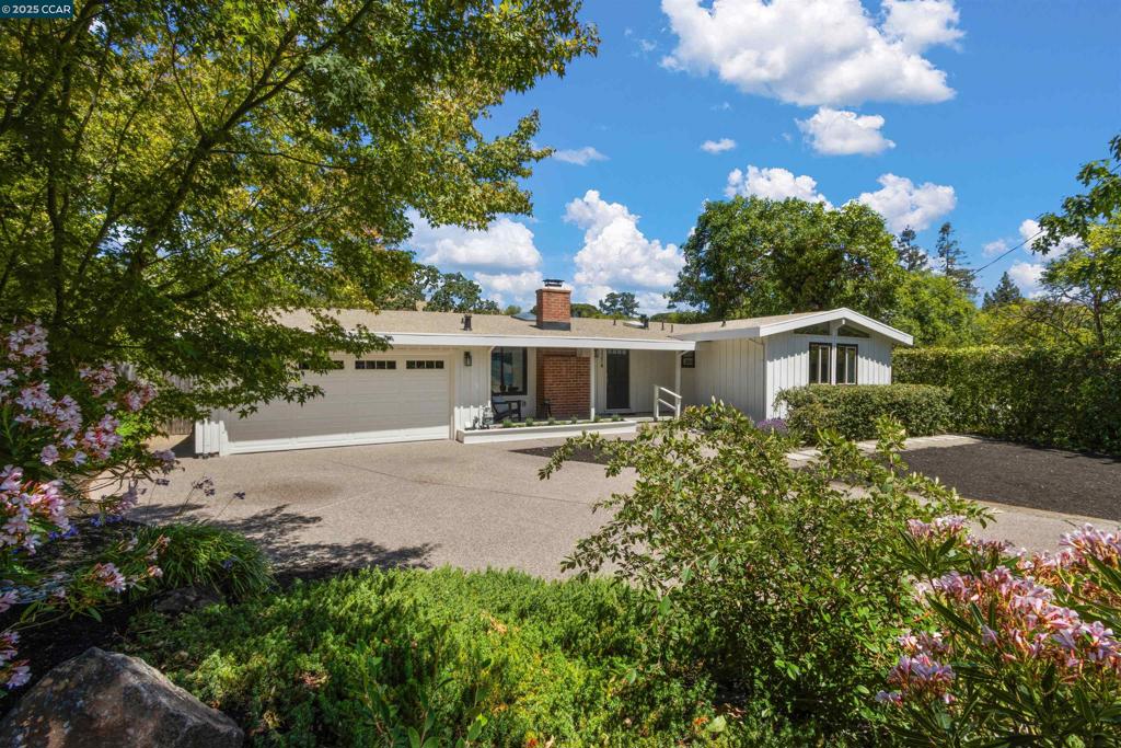 On the market for the first time in over 50 years, this special property has been lovingly cared for and is ready for its next chapter. The living room features painted, beamed ceilings, a cozy fireplace, and a skylight that fills the space with natural light. The kitchen has shaker cabinets, granite countertops, stainless steel appliances, and a breakfast bar for casual dining. The adjacent dining area offers abundant built-in storage and flows into the comfortable family room, which opens to the spacious, private backyard. The main house offers 4 bedrooms and 2 bathrooms, with an easy, casual flow ideal for everyday living. Three of the four bedrooms feature hardwood floors and high ceilings. There is an additional room with a half-bath, perfect for visitors, a creative studio, or a quiet office retreat. Outside, enjoy a lovely patio and lawn area, perfect for relaxing, BBQs, or gardening. There is plenty of room to play, garden, entertain and create your ideal outdoor lifestyle. Located close to top-rated schools, the Lafayette Community Center & Park, Lafayette-Moraga Regional Trail, and just minutes from Lafayette and Moraga’s many amenities — this neighborhood is known for its peaceful, tree-lined streets and wonderful sense of community.