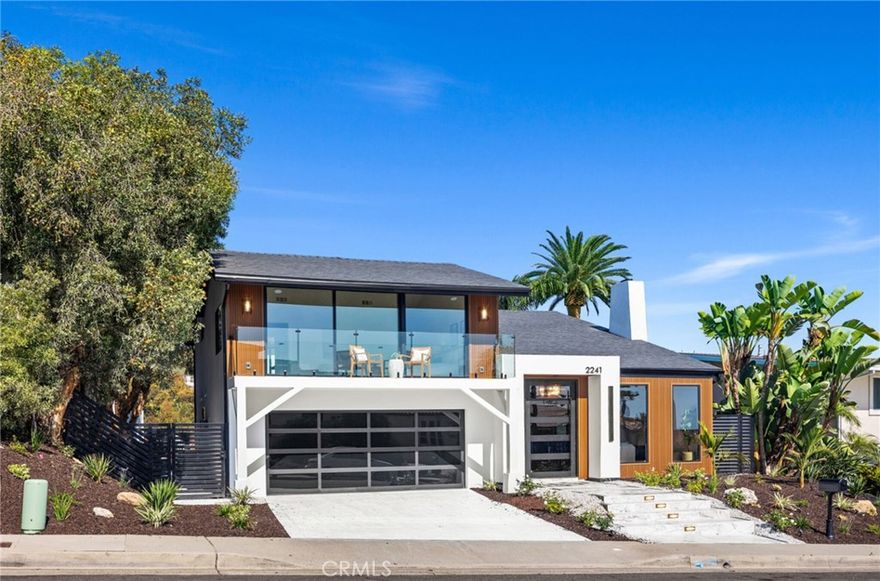 Completely  reimagined, this architectural gem blends striking modern design with the warmth and ease of coastal living. Beyond a custom oversized front door, you’re welcomed into a dramatic open-concept layout with soaring ceilings, abundant natural light, curated finishes, and effortless indoor-outdoor flow.The main level showcases spacious living and dining areas anchored by floating stairs and a sleek fireplace, while the heart of the home—a designer kitchen—features custom cabinetry, quartz countertops, full-tile backsplash, waterfall-edge islands, wide-plank wood flooring, and ambient lighting. Premier Viking appliances, including a six-burner range, ensure a true chef’s experience. The flexible layout is designed with both gatherings and private retreats in mind, making the home feel expansive yet intimate.Upstairs, the primary suite is a personal sanctuary with a private covered balcony framing endless ocean views. The spa-inspired bathroom offers a freestanding soaking tub, dual vanities, and a walk-in shower, while a boutique-style closet completes the retreat. Each secondary bedroom is en-suite, providing comfort and privacy for family and guests alike.Walls of glass dissolve the boundary between indoors and out, opening to multiple decks and sophisticated entertaining spaces. The serene backyard is an entertainer’s dream, featuring a spa, BBQ island, fire pit, multiple lounge and dining areas, paver pathways, and a spacious turf with potential for a pool or ADU. The ultra-private rear yard enjoys sweeping views of Saddleback Mountain and a peaceful park-like valley below.With flexibility for multi-generational living, the first floor includes a full guest suite, while the upper level maximizes panoramic vistas of the Pacific Ocean, mountains , canyon and glittering city lights.

Located just minutes from pristine beaches, top-rated schools, and San Clemente’s charming downtown, this is coastal California living at its finest—a truly turnkey dream home.