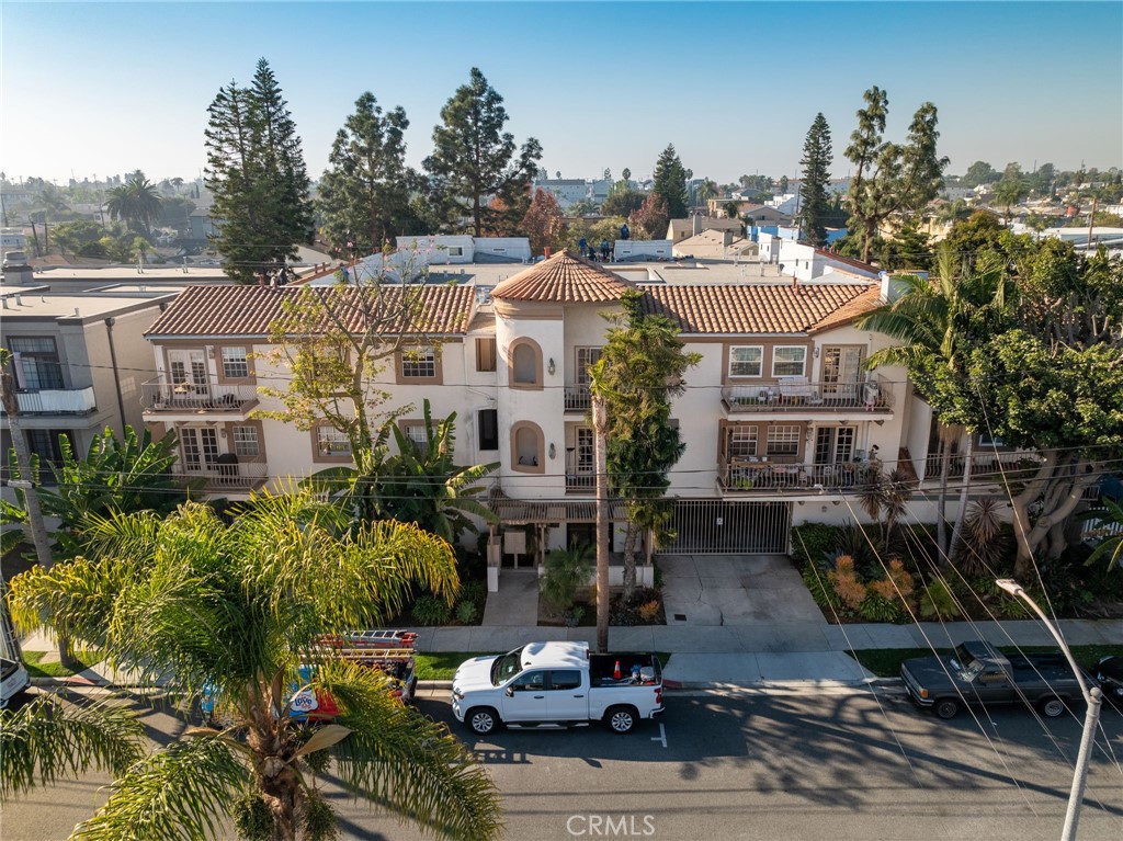 Located in the famed Eastside Circle, Casa Roswell is a charming Spanish-style building on a tree-lined residential street. The secured access entrance leads to a beautiful center courtyard with tranquil fountain. This condo features a highly desirable great room layout, perfect for entertaining! Or light the fireplace and enjoy the view from the balcony while relaxing in the living room. A well-maintained kitchen, spacious master with en-suite bathroom, secondary bedroom, additional bathroom and plenty of storage round out this ideal floorplan. The gated garage has two tandem parking spaces and even more storage. Owner pays for water and trash service, tenant is responsible for gas/electric. You are walking distance to bars and restaurants on Anaheim Blvd and in the Traffic Circle, and just minutes away from Downtown Long Beach, CSULB, dog beaches, golf course, tennis courts, parks, freeways and the ocean. You don't get more centrally located than this, must see!