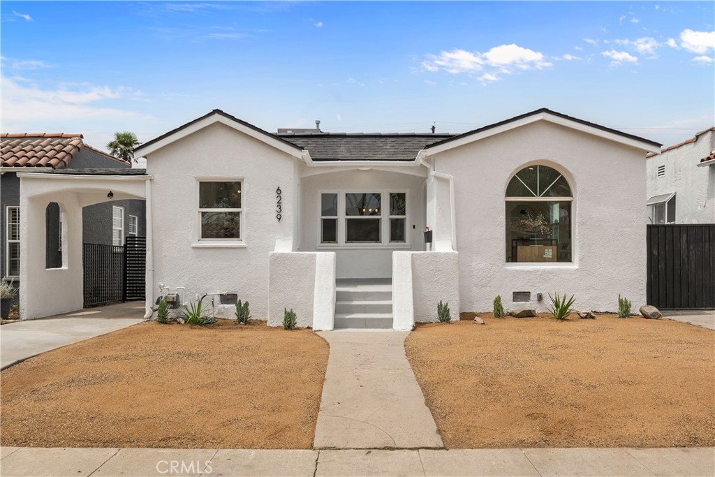 Welcome to this beautifully renovated single-story, Spanish-style home, where modern design meets luxurious comfort. Located in a highly desirable neighborhood in Los Angeles, CA. This stunning property boasts a spacious open floor plan with three generously sized bedrooms and various premium features that elevate your living experience. Two full bathrooms have been tastefully renovated with modern mid-century touches. Step inside through a chic front door and be greeted by the inviting ambiance, enhanced by recessed lighting, new white interior paint, and premium laminate wood flooring throughout the home. The heart of this home is the chef-inspired kitchen, complete with gleaming quartz countertops, all-new stainless steel appliances, shaker-style slow-close cabinetry, and a custom peninsula with a waterfall finish perfect for both cooking and entertaining. There is a warm and inviting family room, featuring a beautiful wood-burning fireplace that provides an ideal setting for relaxation. This home offers a detached garage that has been cleanly finished with drywall and paint, providing ample storage or to use as a gym/entertainment space. Enjoy the private and cozy backyard to host all of your special gatherings. With its thoughtful design, premium finishes, and a fantastic layout, this home is the perfect blend of modern living and comfort. Great location with all the amenities that Los Angeles has to offer, don't miss this chance to make this property your DREAM HOME!