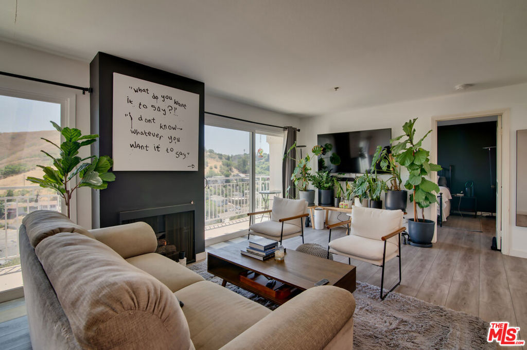Modern 2BR/2BA Condo in Gated Community w/ Luxury Upgrades, Views & Amenities. Welcome to your fully furnished, move-in-ready oasis in a private, gated community! This beautifully remodeled 2-bedroom, 2-bathroom condominium offers upscale living with state-of-the-art upgrades and panoramic sunset views. The open-concept layout features a sleek, fully updated kitchen with modern cabinetry, high-end stainless appliances, and a reverse osmosis water filtration system. Relax in the bright living space or step out onto your double balcony to enjoy breathtaking evening skies and city views. Enjoy the convenience of EV charging, underground parking, and access to resort-style amenities including a community pool, BBQ/grill area, and outdoor play space. Inside, a Lululemon Smart Mirror offers an in-home fitness experience without ever leaving your living room. Spacious Bedrooms featuring modern bathrooms and ample storage. Available short term or long term.
