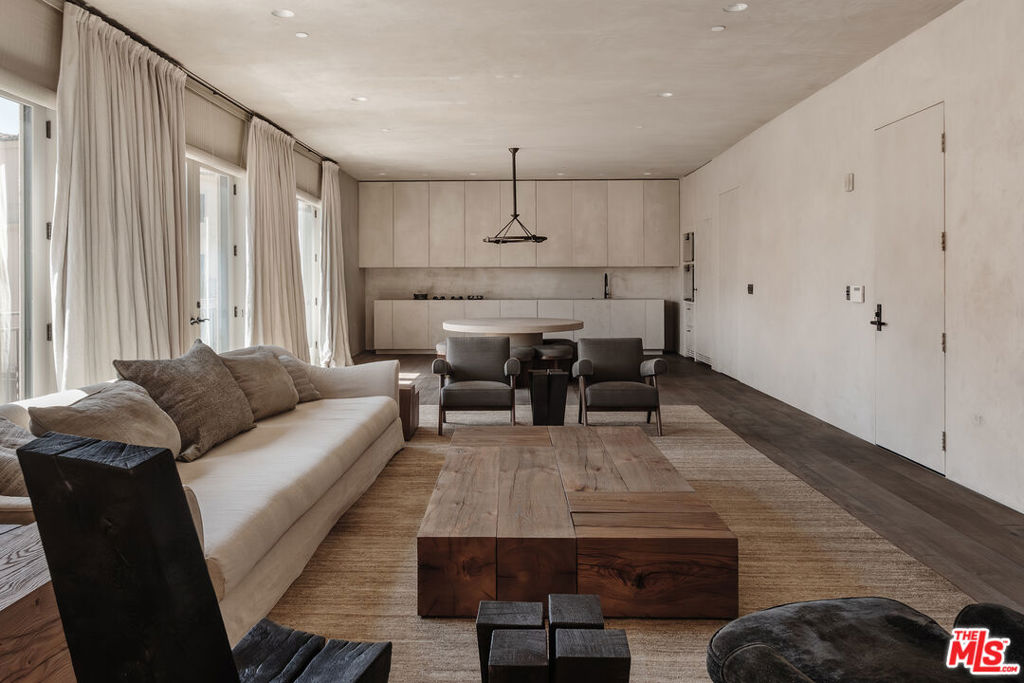 The Calabasas Residence by Vincent Van Duysen is an expression of quiet luxury, where the acclaimed Belgian architect's focus on form, material, and proportion shapes every detail. Wide-plank European oak flooring anchors the space, while concealed doors and custom plaster walls dissolve the boundaries between art and architecture. Throughout the day, natural light moves through the interiors, casting subtle warmth across a neutral palette. Arrive via a semi-private elevator into a foyer that opens to the central living space. The great room flows seamlessly across open-plan living, dining, and kitchen areas - each defined by proportion, light, and texture. The kitchen is both discreet and highly functional, outfitted with integrated Gaggenau, Sub-Zero, and Bosch appliances, hidden behind bespoke millwork. Three en-suite bedrooms provide restful sanctuaries, two of which open onto private terraces that extend the living experience outdoors. The primary suite occupies its own wing for absolute privacy and features a spa-inspired bath with a Jee-O Soho soaking tub, sculptural vanities, and curated hardware. Every element is bespoke, from the furnishings and window treatments to the architectural lighting - each piece designed by Van Duysen's studio. Residents enjoy access to communal amenities, including a pool, spa, gym, and outdoor gathering areas. Located within the private gates of the Calabasas Avanti enclave, just moments from The Commons, Hidden Hills, and the Calabasas Tennis & Swim Center, this residence offers a rare architectural experience. European in spirit, Californian in lifestyle.