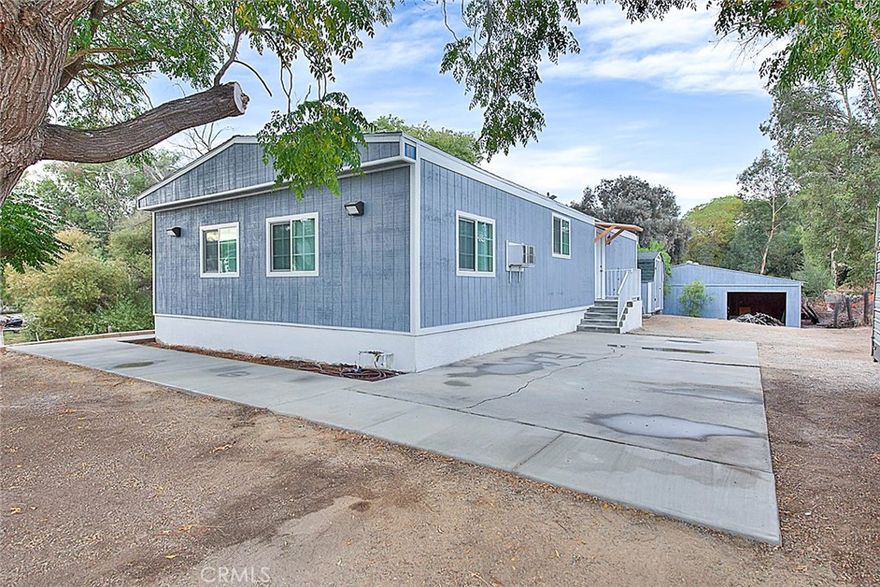 Here's your chance to own an amazing property in Wildomar that provides the perfect blend of a private work/home environment! The home is situated on an extremely private lot that sits at the end of a long driveway and is a total of over 1.2 acres! The manufactured home has been completely remodeled with new kitchen and bathrooms, recessed lighting, windows, doors, and flooring. Behind the home you'll find a huge workshop/warehouse that measures approximately 3000sf and provides plenty of space for toys, storage, or workspace! This property is close to restaurants, supermarkets, shops, and within 20 minutes of the Pechanga Resort and Casino! Seller financing will also be considered!
