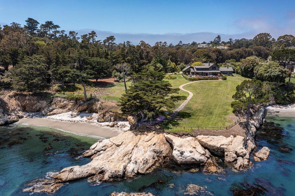 This extraordinary ocean front home in Pebble Beach stands above and apart: Sweeping ocean side lawn leads down to a beautiful private cove and the largest sand beach along the Pebble waterfront; a short stroll to The Lodge and all the amenities it has to offer; spectacular views across Stillwater Cove to the PB Golf Links and Carmel Beach; classic, comfortable architecture offers the perfect setting for family and friends. A true gem.