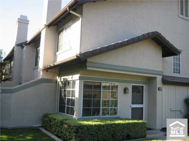 End unit (extra windows in livingroom and hallway upstairs) 2 story remodeled townhouse with 2 bedrooms, 1 full bath and 2 1/2 bathrooms (1 on second floor and 1 on first floor). Remolded with ceramic title floor in bathrooms and kitchen and laminate wood floor in bedrooms, hallways and stairways; no carpet. The townhome comes with full size washer/dryer and refrigerator with no warranty, and 2 covered carport spaces with 2 storage cabinets. The community has pools, spas, bbq grills, volleyball courts, basketball courts, and tennis courts. Walk to UCI, University high school, Mason park and shopping centers (University Market Place and Campus Plaza).