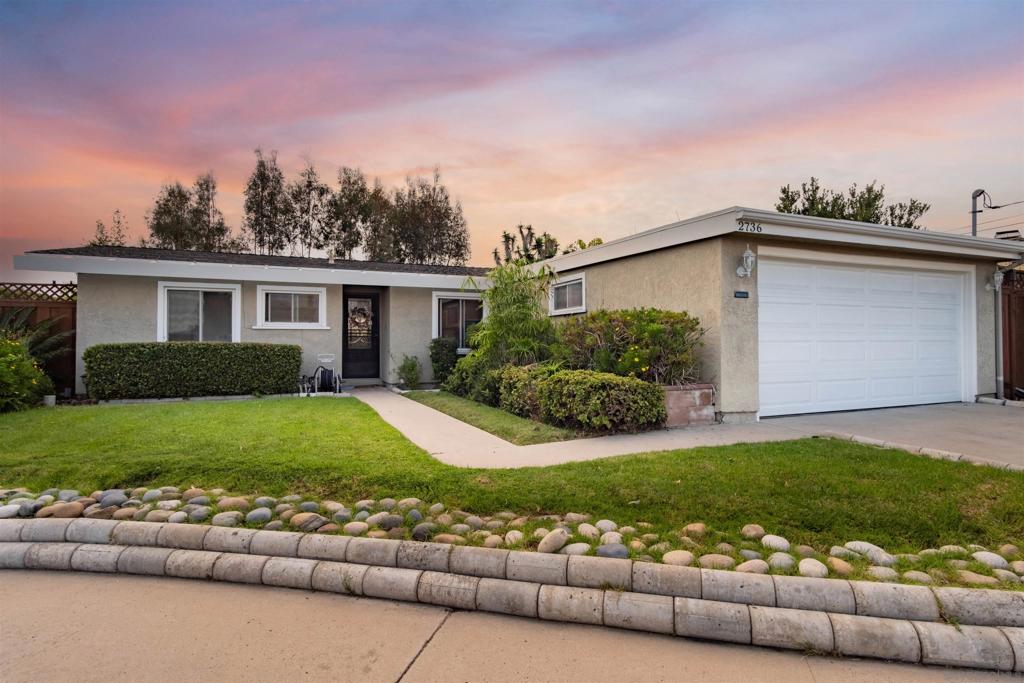 Welcome to this charming single-story home tucked away on a quiet cul-de-sac in the desirable Serra Mesa neighborhood. This 3-bedroom, 2-bath residence perfectly blends classic mid-century character with thoughtful upgrades for modern comfort and style. Step into a bright and inviting living room with large windows that fill the space with natural light. The lush backyard offers serene canyon views and mature fruit trees, creating a peaceful retreat ideal for relaxing afternoons, weekend gatherings, or enjoying warm San Diego sunsets. Inside, you’ll find a freshly painted interior throughout. Further, the home has real wood in the living room and primary suite, durable vinyl in the kitchen installed less than six months ago, and soft, brand-new carpet in the additional bedrooms. Dual pane windows enhance energy efficiency while maintaining a bright, airy feel, and the central air conditioning and heating system ensures year-round comfort. Located in the heart of Serra Mesa, this home offers easy access to major freeways, popular dining spots, shopping, and the best of central San Diego. Snapdragon Stadium is just minutes away, making it effortless to enjoy games, concerts, and other events without sacrificing the peaceful atmosphere of the neighborhood. With its prime location, tasteful updates, and spacious outdoor living areas, this home is a rare find — a perfect combination of comfort, charm, and convenience, ready for you to move in and make your own.