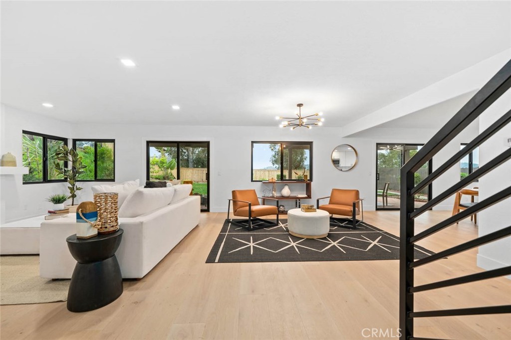 Welcome to 2959 Butler Street, an absolutely gorgeous home located in the heart of the highly desired neighborhood of Mesa Pines in Oceanside. Tastefully remodeled and sitting on a premier lot with stunning views, this home has been re-designed and re-imagined to create a true masterpiece! You are welcomed by an undeniably stunning curb appeal featuring thoughtfully designed landscaping, sleek outdoor lighting and a spacious driveway. Upon entering the front door, the magic continues. Envisioned around the art of entertaining, you will be greeted by an open floor-plan concept that flows effortlessly from one to the next, both indoor and out. From the tastefully designed living room that flows beautifully into the custom kitchen and into the backyard, to the large luxurious bedrooms and artfully crafted bathrooms, one will immediately fall in love with this home! Moving on to the backyard, your private oasis awaits! Featuring an enormous grass lawn, a huge covered patio area, and amazing views. All this surrounded by lush California landscape offering plenty of privacy. This backyard is absolutely perfect for entertaining! Located next to schools, parks, shopping centers, hiking trails and golf courses yet tucked away in a quaint and quiet street. This is one you don't want to miss!