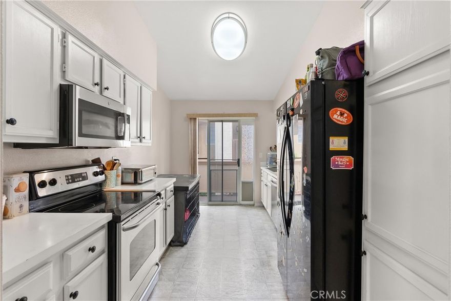 Welcome to coveted, The Hills Community. This spacious upstairs end-unit offers over 1,200 SQFT of comfortable living with 2 bedrooms and 2 baths. Beautiful engineered hardwood floors extend from the entry into the living and dining rooms as well as both bedrooms. It exhibits high ceilings and no one above. 



The large living room is filled with natural light and features a cozy gas fireplace and sliding glass doors that open to a private balcony. A versatile formal dining area serve as a home office or playroom.



A well-appointed kitchen is equipped with stainless steel appliances, abundant cabinet & counter space, and a breakfast nook, with direct access to the balcony.



Boasting high-sloped ceilings with a skylight, the primary suite is sure enlighten the senses. Its dressing area is adjacent to the walk-in closet, and a refreshed bathroom with a brand-new vanity, marble countertop, and modern faucet. The second bedroom is generously sized and also includes its own walk-in closet. A full-size shower completes the hallway guest bathroom.



Additional highlights include an indoor laundry room conveniently located near the bedrooms (with extra storage space and a water heater) plus an exterior storage closet near the front entry. Vertical blinds can be found throughout and as well as ceiling fans in the bedrooms for added comfort and functionality.



Residents of The Hills enjoy resort-style amenities including 2 pools, 3 spas, tennis courts, a fitness center, clubhouse, and 2 playgrounds. Conveniently located near SAVI Ranch shopping, dining, the 91 freeway, and the 241 toll road, and award winning schools.