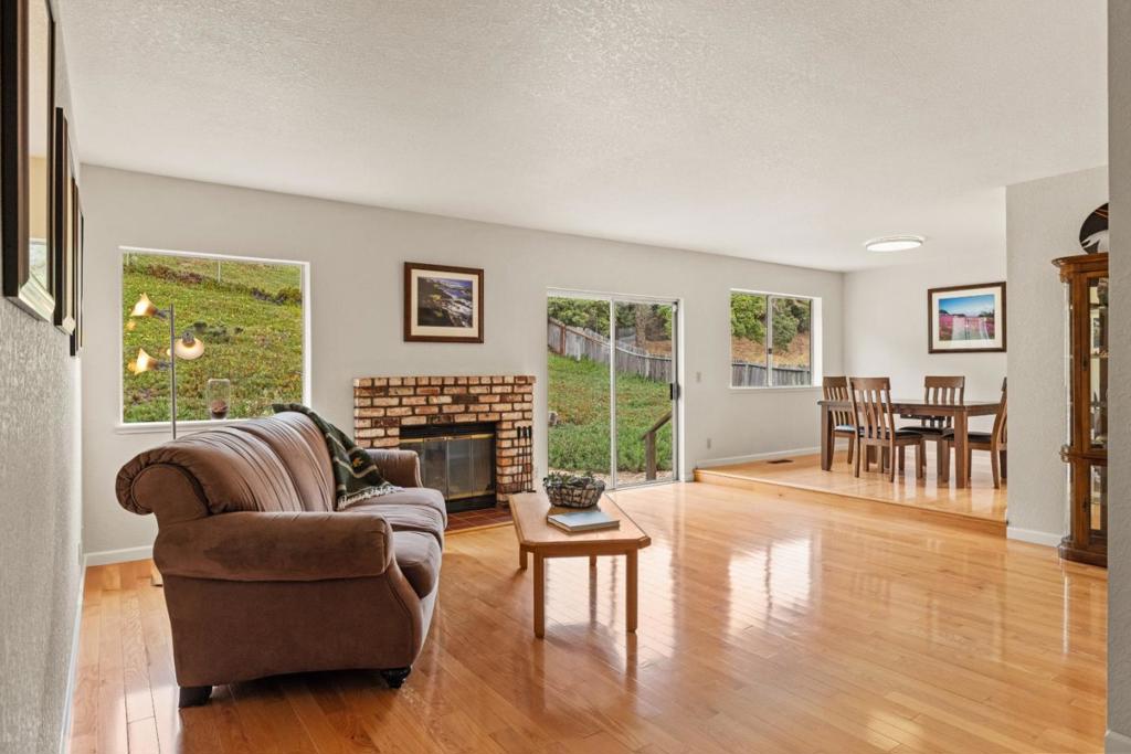 OPEN HOUSE SAT 7/26 FROM 11AM - 1PM. Welcome to 3097 Messinger Drive - a warm and move-in ready home on a spacious quarter-acre lot in one of Marina's desirable neighborhoods. This home is filled with natural light and wood floors throughout to give the home a cozy feel from the moment you walk in. The kitchen is bright and functional, with plenty of storage and a large eat-in area that's great for everyday meals and morning coffee. There's also a formal dining room for hosting family and friends. The living room is roomy and inviting, complete with a wood-burning fireplace and views of the private backyard - no rear neighbors, just serenity. The primary suite is tucked away for privacy and opens right out to the backyard through sliding glass doors. It's the perfect spot to start your day or wind down in the evening. You'll also love the oversized side yard, which offers lots of possibilities - whether it's a play area, a spot for BBQs, room for garden beds, or just more space to enjoy. The two-car garage includes laundry hookups and adds extra convenience. Located close to schools, beaches, shopping, dining, and everything the Monterey Peninsula has to offer, this home blends comfort, function, and location. It's a place you can settle into right away and make your own.