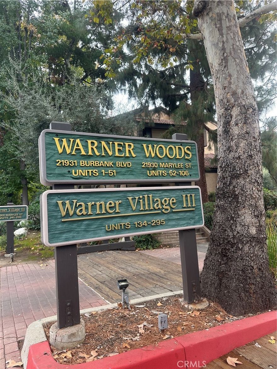 Highly desirable Warner Woods Townhouse located centrally with peaceful views of the pool and luscious flora, mature trees and a babbling brook. This lovely 3-level townhouse has been beautifully updated. Features include 2 spacious bedrooms 2.5 baths and Bonus room that excellent for office or gym downstairs with laundry and direct access to an attached 2-Car garage. The main level features a kitchen with granite counters, a breakfast nook, formal dining area, hardwood floors, living room with gas fireplace and balcony. The large master suite has vaulted ceiling with a walk-in closet and additional closet space in the room and balcony to enjoy the lush,calming landscaping. Other wonderful assets include converted bar extra storage space and wood shutters throughout, wood rails, smooth ceilings, ceiling fans and so much more. Two heated swimming pools, Jacuzzi's and abundant guest parking. Minutes away from the Westfield theaters, "The Village", Topanga Mall and the "Concerts in the Park" at Warner Park, with a great "Walk-ability" score. This spacious townhouse is the perfect retreat to call home.