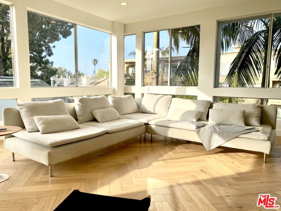 This modern 2 bedroom / 2 bathroom plus bonus room condo has been completely remodeled. The oak floors and the black and white color palette combined with 9 ft ceilings and floor-to-ceiling windows make this home feel spacious and bright. The master bedroom has a fireplace, two very large closets, and an additional walk-in closet. The en-suite bathroom features a free standing tub and frameless shower. Special attention was given to lighting throughout the home with recessed lighting in every room, soffit lights in kitchen and bathrooms, an original Herman Miller Nelson Bubble pendant lamp, all on dimmers to give full control of the ambiance. The large bonus room can serve as a den, media room, or a home office. There is a surprisingly large amount of closet space and storage throughout. The two independent central air systems allow for true dual zone temperature control. Located in the heart of the West Side, between Santa Monica, Sawtelle, West LA, Century City, Beverly Hills, and Westwood this small architectural building, of only 8 units, offers modern living near everything West Side. Great Freeway access to both the 405 and 10, near UCLA, and walking distance to the Metro Expo line which can take you downtown or to the beach. This condo is perfect for someone who loves modern designs and is looking to enjoy west side living in a bright urban home with lots of sky, tree tops, and city views. No sign on the property. Call anytime to schedule a private showing.