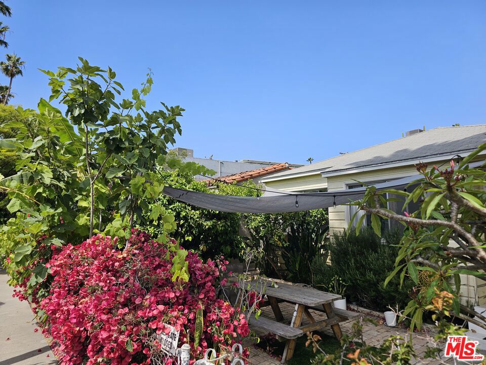 We're excited to share a fantastic opportunity to create value on one of the best streets in Venice. This income property is located on an extra-wide, tree-lined street, offering close proximity to Abbot Kinney, Rose Avenue, and some of the hottest new spots on Lincoln Blvd. The property itself boasts timeless charm and character, surrounded by lush landscaping and mature fruit trees. It's situated on a beautiful street among multi-million dollar properties. The front unit is a spacious and bright 2-bedroom, 1-bathroom unit with access to the front yard. The attached rear unit is a 1-bedroom, 1-bathroom unit with a separate entrance off the side yard. There's additional outdoor space between the units and the large two-car garage with an extra laundry room area. Both units feature many original finishes, hardwood floors, and great natural light. Please note that the property is currently tenant-occupied. This property can potentially work for an owner-user. Live in one of the units and build an Accessory Dwelling Unit (ADU) above the garage for additional income. Rent control laws apply, and all buyers to do their own due diligence as they relate to any tenant relocations. For Investors and Developers, the lot has tremendous potential to be transformed into a stunning duplex with the option for a third ADU unit, totaling three units. This is a unique opportunity in a highly desirable location for a savvy investor or owner-user. The property is being sold As-Is. Inspection reports are available upon request. DO NOT DISTURB TENANTS.
