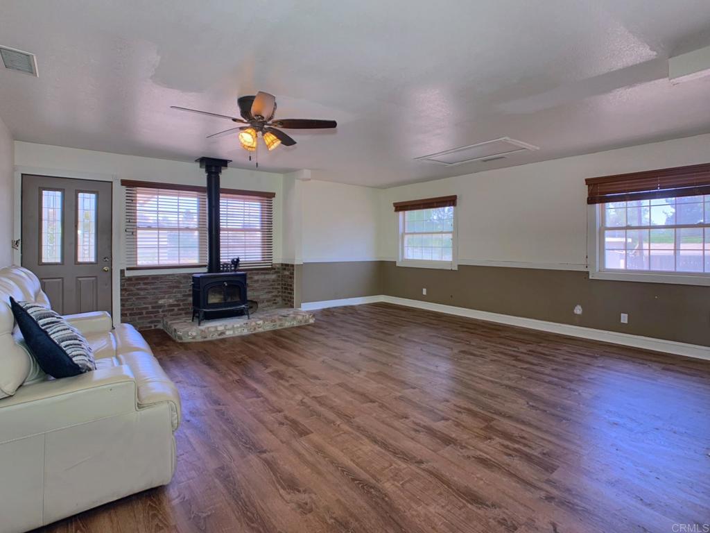 ***PRICE IMPROVEMENT***Welcome home to 1390 Dewey Place! This charming 3 bedroom, 2 bathroom gem sits on a spacious 0.33 acre lot and boasts 1176 square feet of living space in the main building. The open floor plan is perfect for entertaining, with a Vermont Casting wood stove and central heat and air to keep you comfortable year-round. Features such as new vinyl plank flooring and fresh paint throughout show pride of ownership! In addition, brand new installed patio TREX deck is perfect for entertaining or relaxing at the end of the day. The newer roof, double pane windows, and fence provide peace of mind and added value This delightful property also features a separate cottage with bathroom offering excellent ADU potential. Little-known fact-This cute building used to be the Original Campo library. A chicken coop and raised garden beds make it easy to grow your own produce and potential for chickens and fresh eggs. . The extra large carport and additional outside covered parking offer plenty of space for your vehicles, toys and /or RV while a 400 sq ft adjacent storage room provides ample storage. The expansive backyard provides the room you need for entertaining guests, possible ADU, pool, etc. Don't miss out on this unique jewel with endless possibilities!