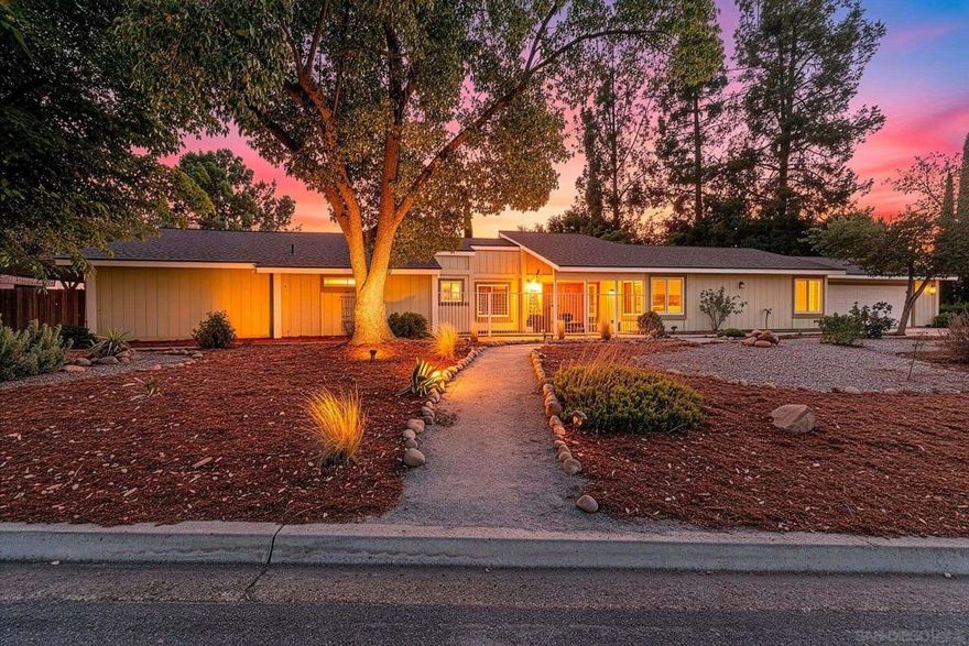 Assumable Financing Available. Welcome to this warm and inviting ranch-style home in San Diego Country Estates. Filled with natural light, this thoughtfully designed floor plan offers 4 bedrooms and 3 bathrooms on a spacious 0.44-acre corner lot. Interior highlights include durable LVP flooring, plantation shutters, crown molding, and a beautifully appointed kitchen with stainless steel appliances, granite countertops, and a breakfast bar that opens to the family room with vaulted ceilings and a cozy fireplace.  The private primary suite features exterior patio access, a walk-in closet, and its own en-suite bathroom, while the remaining bedrooms are thoughtfully located on the opposite side of the home for privacy. Step outside to enjoy multiple outdoor spaces, including a gated front porch and a private patio off the primary suite. The property also offers abundant parking with space for an RV or boat, plus energy-efficient solar.  San Diego Country Estates provides resort-style living with 2 equestrian centers, 2 pools and spas, an 18-hole golf course with restaurants and a pro shop, lighted tennis courts, and miles of hiking, biking, and riding trails. A perfect blend of comfort, functionality, and lifestyle awaits!
