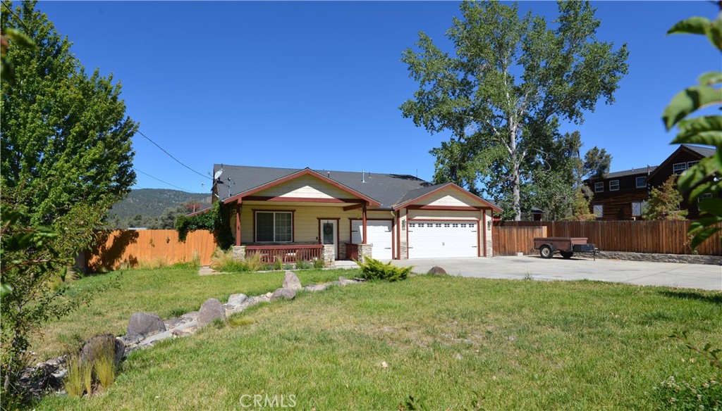 BEAUTIFUL custom, single story home located on over a quarter acre in the lovely community of Pinon Pines Estates. This spacious mountain home welcomes you into an inviting light and airy living area where you are immediately impressed by the comfort and functionality. Next you'll see the gorgeous open concept kitchen with granite countertops and an island, perfect for gathering around with friends and family. Open to the second large living area, you can easily entertain guests or simply enjoy the serenity around you. From there you'll find a hallway with a convenient half bath, a laundry room, access to the two car garage, and a storage/workshop area which was originally a third garage space (easily converted back). Two nice sized bedrooms and a full bath are down the hall which then leads to an amazing primary suite with all the amenities you dream of, including dual sinks, granite countertops, separate tub and shower, privacy toilet, a vanity counter, and a huge cedar lined closet. Outside, the appealing front yard includes a massive sized driveway for ample parking, and the front porch is the perfect setting for your morning coffee or evening enjoyment. The huge fully fenced backyard offers awesome mountain views and is a palate for your personal touch. Attic is partially dry walled and provides extra storage space. Come and experience four seasons in this special mountain community, away from city life, and yet less than an hour from Bakersfield and Santa Clarita.