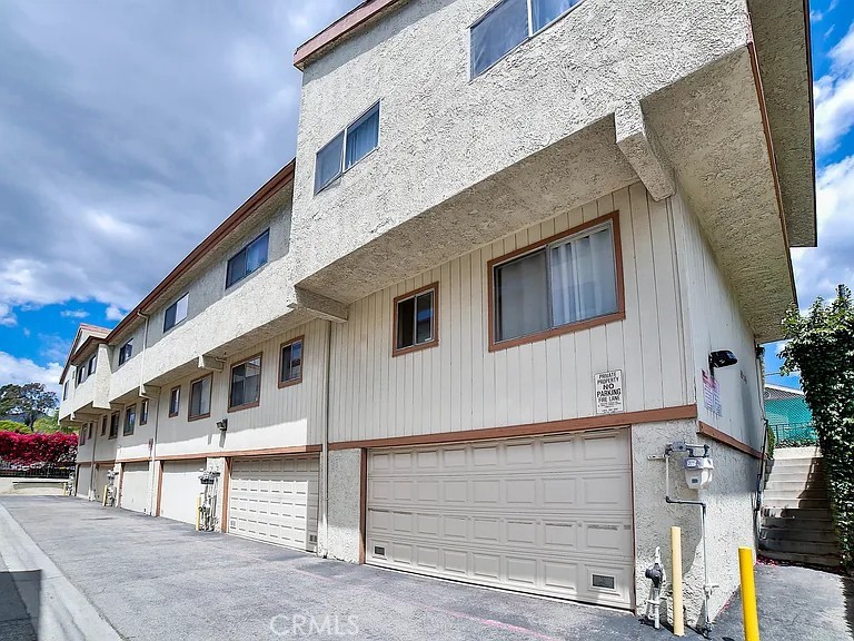 Opportunity knocks at a great price! 3-bedroom, 2-bathroom tri-level townhome in Sylmar. Needs some TLC but you can transform this property into your dream home. ONE OF THE LOWEST HOA FEES IN THE SFV $265/month. Attached garage can accommodate not 2, not 3, but 4 cars! Yes, up to 4 cars fit into the attached garage and it still has plenty of additional storage space, perfect for your vehicles and tools. Great location only minutes away from nearby shops, restaurants, schools, parks and 210/118 freeways for easy commuting. More pictures coming soon.