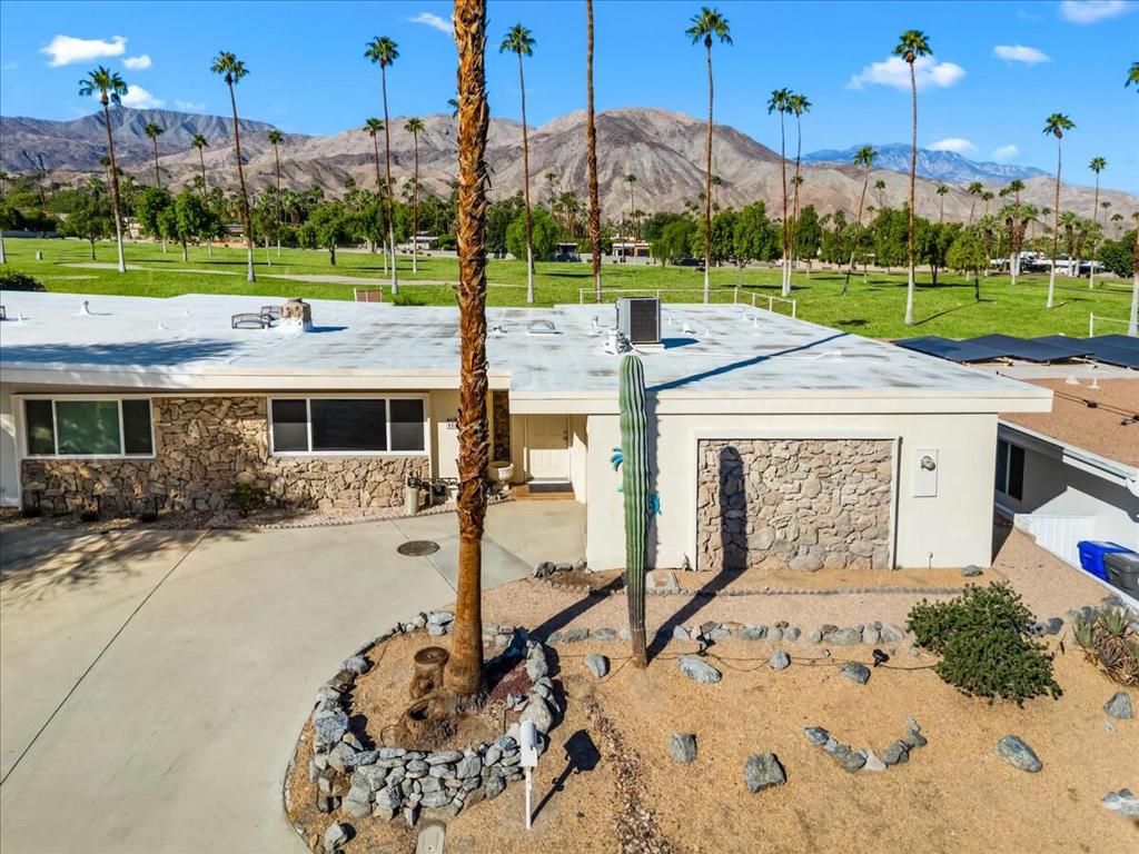 Welcome to your desert oasis! This 2-bedroom, 2-bath home spans over 1700 sq. ft. and sits just off the Shadow Mountain Golf Course, offering breathtaking mountain views with the most sensational sunsets. Mornings are bright and cheerful, and evenings are made for relaxing in your private pool-cocktail in hand. Best of all, it's country club living with NO HOA. Step inside the open floor plan with ceramic tile flooring and carpeted bedrooms. The updated kitchen shines with quartz countertops, modern cabinetry, custom tiled backsplash and kitchen counter seating. The fireplace sets the scene for cozy winter nights, while the separate dining area is perfect for entertaining. The primary bedroom has an en-suite bathroom featuring dual sinks, a vanity area, and generous closet space. Additional perks include a one-car attached garage for convenience and an indoor washer/dryer. This highly sought after South Palm Desert location is surrounded by multi-million dollar homes, just steps away from El Paseo, with its world-class restaurants and shopping. Tucked away on a quiet dead-end street, this home makes an ideal second home, full-time residence, or investment property. Shadow Mountain Golf Resort-the first golf course in Palm Desert, designed by Gene Sarazen, has a new 18 hole putting green and renovated bar and grill. Don't miss your chance to make this desert dream home yours.