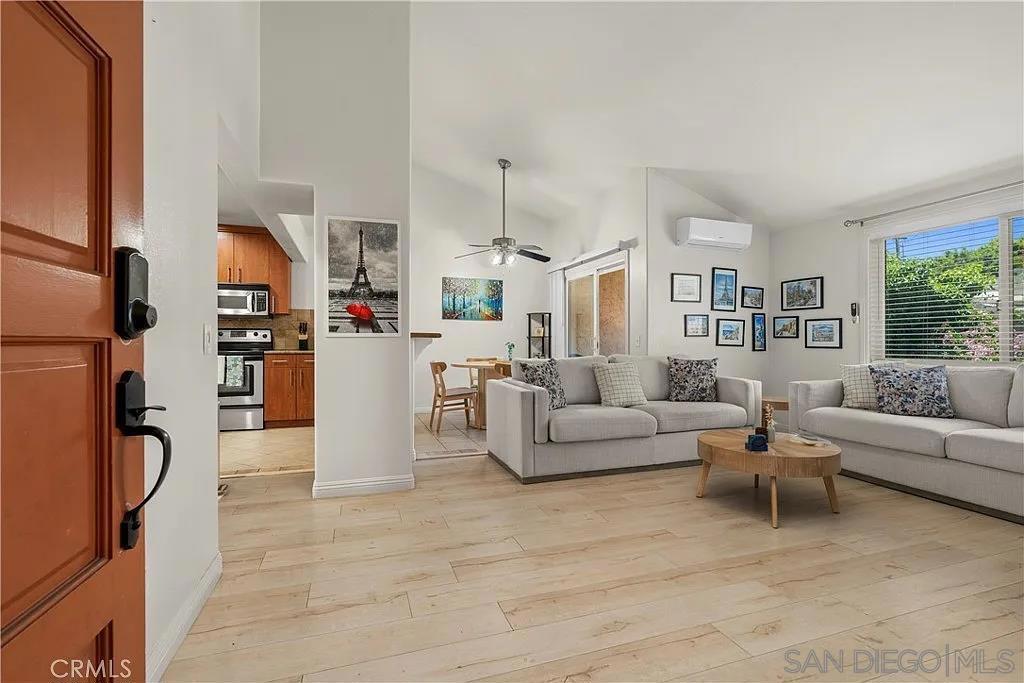 Welcome to 7003 Saranac Street Unit 203, a beautifully upgraded top-floor end-unit condo in San Diego’s College East neighborhood. This bright and spacious 2-bedroom, 2-bath home is located within a secure gated community that offers key card entry and convenient access to nearby biking and hiking trails, Lake Murray, local parks, and tree-lined sidewalks. Inside, the open layout features vaulted ceilings, sleek laminate flooring, and recessed lighting throughout. The kitchen is thoughtfully updated with granite countertops, stainless steel appliances, a breakfast bar, and a separate formal dining room. The living area opens to a private balcony, while both bedrooms are on the main level, including a comfortable primary suite with its own full bath. Additional highlights include mirrored closet doors, ceiling fans, in-unit laundry, and one assigned covered carport space. With no one above and only two shared walls, this end-unit home offers privacy and comfort just minutes from SDSU, Lake Murray, shopping, dining, and the 70th Street trolley. Please note: no smoking, no Airbnb or other short-term rentals. Pets allowed with restrictions.