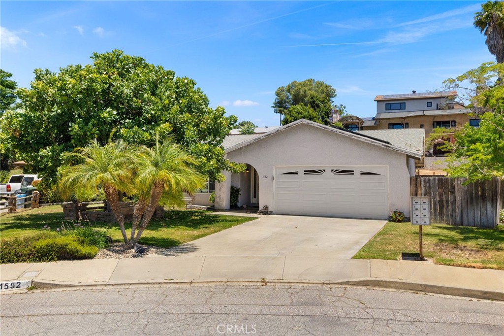 Don't miss this fabulous 4-bedroom, 2-bath home, nestled on a quiet cul-de-sac. This spacious 1,469 sq. ft. residence offers an inviting floor plan and boasts energy-efficient upgrades, including newer dual-paned windows and fully owned SOLAR PANELS. Step inside through the elegant leaded glass front door and discover a spacious living room featuring a cozy fireplace, perfect for relaxing evenings. The REMODELED KITCHEN has been completely upgraded to impress, showcasing quartz countertops, white shaker cabinets, stainless steel appliances, single-basin undermount sink, and a stylish custom tile backsplash. Enjoy casual meals at the breakfast bar with seating for two complete with pendant lighting. Adjacent to the kitchen, the dining room leads directly to a spacious outdoor covered patio, perfect for al fresco dining and entertaining. Outside, you'll find a lovely, large backyard, a dedicated garden area, and a convenient storage shed. Plus, you'll love the mature fruit trees on the property, including plum, kumquat, fig, pear, apple, orange, lime, and avocado, just to name a few! Adding to its appeal, this home has NO HOA fees and boasts LOW TAXES. Plus, it's just a short stroll to The Forgotten Barrel Winery, San Diego's oldest winery, rich with California history. This home offers a perfect blend of comfort, modern amenities, and a fantastic location.