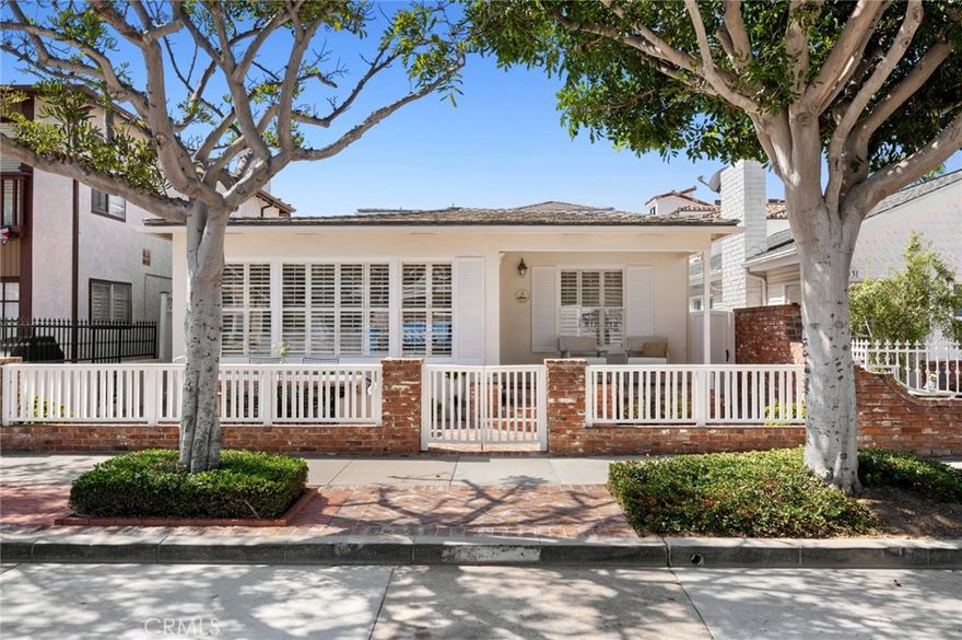 Experience the best of beachside living in this meticulously maintained 4-bedroom, 3-bath coastal home. 1537 E Ocean Boulevard is just steps from the sand, this residence welcomes you with a charming front patio and flows into a spacious living room highlighted by a cozy brick fireplace and beautiful hardwood floors. The thoughtfully designed layout includes inviting indoor and outdoor spaces, with a private brick patio ideal for relaxing in the ocean breeze. Upstairs, the full primary suite offers a true retreat with a generous layout, abundant natural light, and a peek-a-boo view of the Pacific. With timeless character, modern comfort, and an attached garage, this home captures the essence of coastal charm and everyday convenience.
