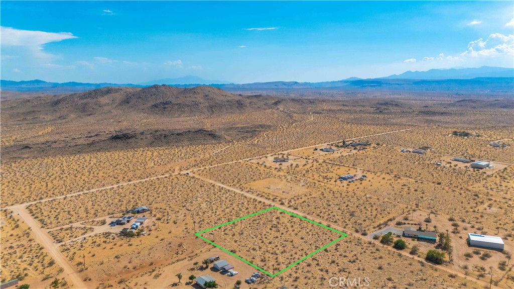 This 2-acre lot in Landers provides an ideal setting for your dream home or desert retreat. With utilities conveniently located in the street, building is made easy. Enjoy breathtaking views of Goat Mountain, offering a stunning natural backdrop. This property combines convenience, beauty, and tranquility in a serene desert environment.