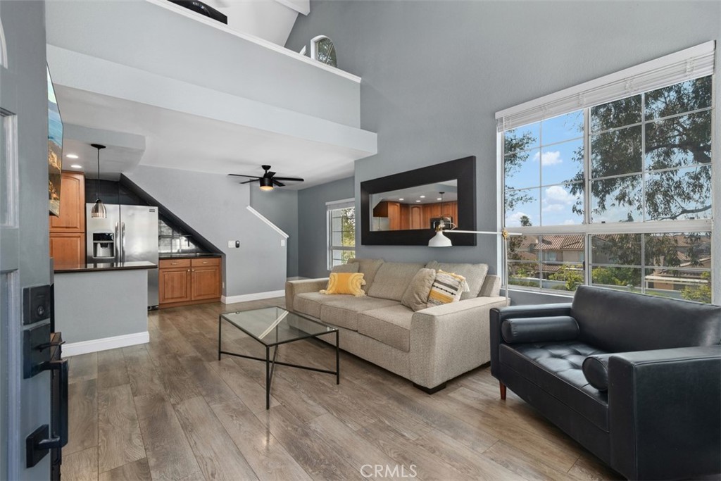 Welcome to this beautifully upgraded upstairs corner unit in the desirable Canyon Bluffs community of Mira Mesa, San Diego. This bright and airy 2-bedroom, 2-bathroom condo includes a spacious loft, vaulted ceilings, and abundant natural light. The upgraded kitchen features upgraded cabinetry, pendant lights, stainless steel appliances and granite countertops. The primary bedroom showcases a stylish wood accent wall. The living room fireplace has been refreshed with a contemporary/industrial look. Enjoy the convenience of a newer washer, dryer, and hot water heater, plus ample storage with a large attic, patio closet, and carport storage closet. Community amenities include a pool and spa, offering resort-style living in a prime location. Nearby you will find various hiking trails, restaurants and the 5 Freeway.